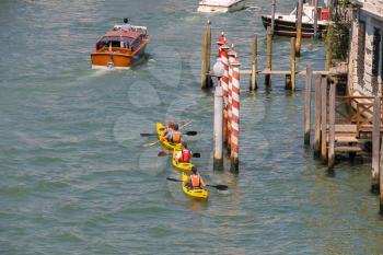 Venice, Italy - August 13, 2016: People on kayaks in Grand Canal