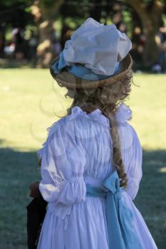 Villa Sorra, Italy - July 17, 2016: Woman in vintage dress and hat on Napoleonica event. Costumed reconstruction of historical events. Castelfranco Emilia, Modena