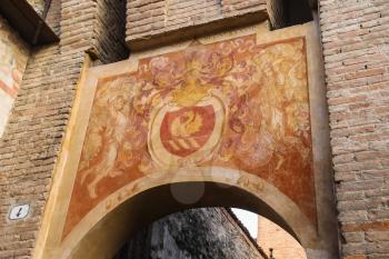 Vignola, Italy - October 30, 2016: Antique painting on old arch in Vignola castle. Emilia-Romagna, Modena