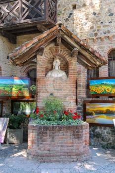 Grazzano Visconti, Italy - August 07, 2016: Artistic bust in the courtyard of medieval castle