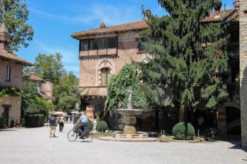 Grazzano Visconti, Italy - August 07, 2016: Tourists in the courtyard of ancient castle