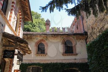 Grazzano Visconti, Italy - August 07, 2016: Old buildings in courtyard of ancient castle