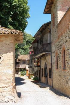 Narrow street of ancient Grazzano Visconti, Italy