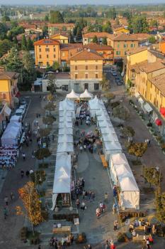 Spilamberto, Italy- October 02, 2016: People on festivities in historic center. Top view from fortress