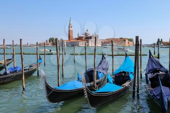 Venice, Italy - August 13, 2016: Empty gondolas at the pier