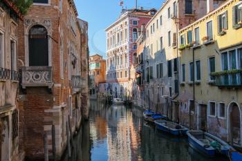 Narrow water street of historic center of Venice, Italy