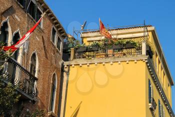 Picturesque houses with flowers on terrace. Venice, Italy
