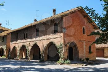 Old building in courtyard of ancient castle in Grazzano Visconti, Italy