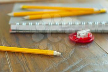 Education study kit. Pencils notepaper on workplace. Personal notes reminder. Idea organizer closeup. Working place stationary.