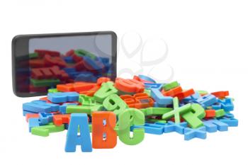 Royalty Free Photo of an E-Book and Alphabetical Magnets