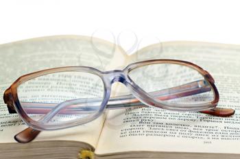 Royalty Free Photo of Reading Glasses on a Book