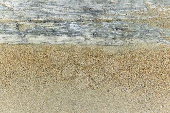 Royalty Free Photo of a Wooden Board in the Sand