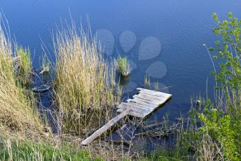 Royalty Free Photo of a Homemade Wooden Platform on the River
