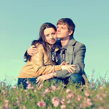 Outdoor Portrait of young couple against the sky