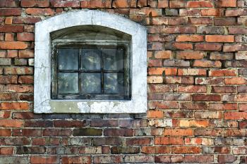 Old brick wall with wooden window in the background in grunge style