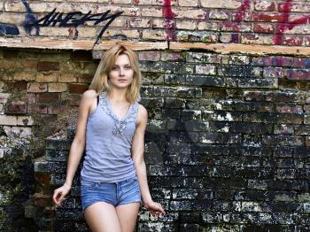 portrait of a young sensual blonde on a background of a wall with graffiti