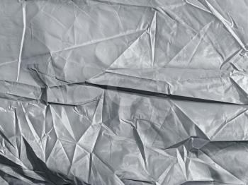 background of crumpled silver synthetic fabric