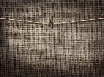 Royalty Free Photo of a Clothesline on a Linen Background
