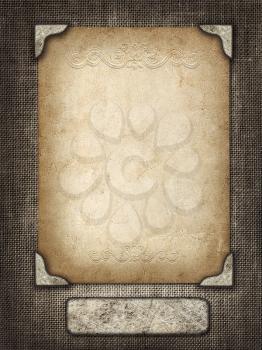 Vintage card in a carved frame on fabric background