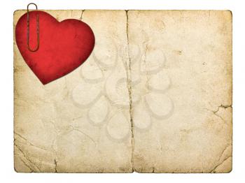 old paperboard card with red paper heart isolated on white background