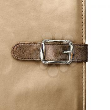 notebook closeup with buckle in the form of a leather strap