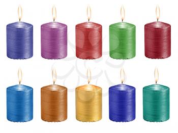 set multicolored celebratory burning candles isolated on white background