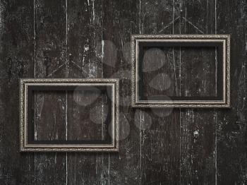Old wooden frames on vintage  wooden background