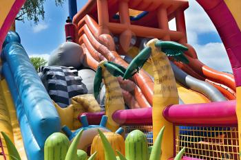 children's inflatable attraction with a springboard