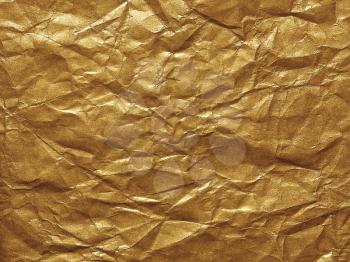 golden crumpled paper as a background