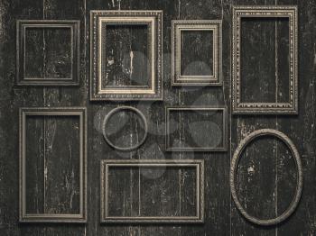 Old wooden frames on vintage wooden background