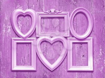 Decorative photo frames on a wooden background