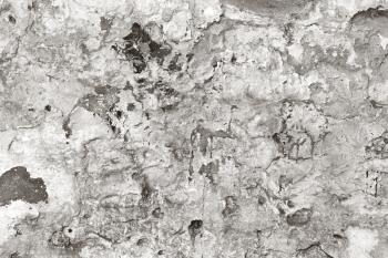 Black and white old plaster wall as a grungy background
