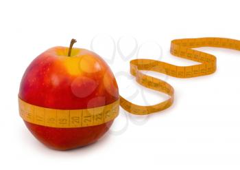 Red apple and centimeter isolated on a white background