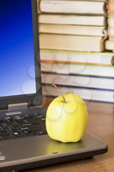 Royalty Free Photo of an Apple on a Laptop
