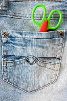 Royalty Free Photo of Scissors in a Pocket