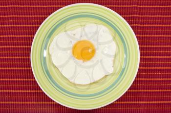 Royalty Free Photo of an Egg on a Plate