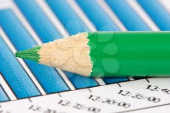 Royalty Free Photo of a Pencil on Financial Graphs