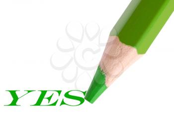 Royalty Free Photo of a Green Pencil Writing Yes