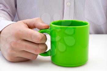 Royalty Free Photo of a Businessman Holding a Cup