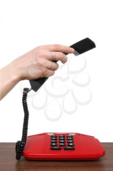 Royalty Free Photo of a Woman Picking Up a Telephone