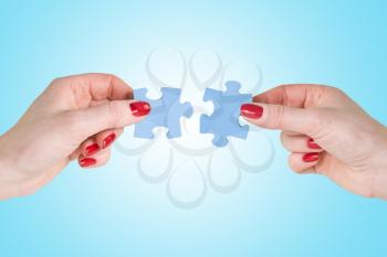 Royalty Free Photo of People Holding Puzzle Pieces