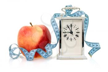 Royalty Free Photo of a Clock and an Apple