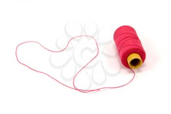 Royalty Free Photo of a Heart in a Spool of Thread