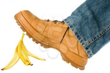 Royalty Free Photo of a Man Stepping on a Banana Peel