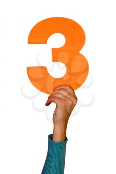 Royalty Free Photo of a Person Holding the Number Three