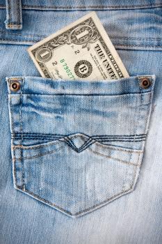 Royalty Free Photo of a Dollar Bill in a Pocket
