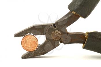 Royalty Free Photo of a Coin in Pliers