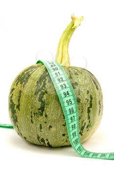 Royalty Free Photo of a Vegetable Wrapped in Measuring Tape