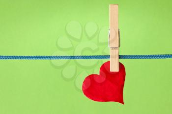 Royalty Free Photo of a Heart on a Clothesline