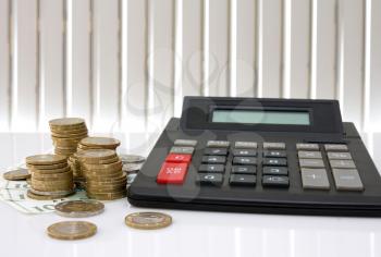 Royalty Free Photo of a Calculator and Coins